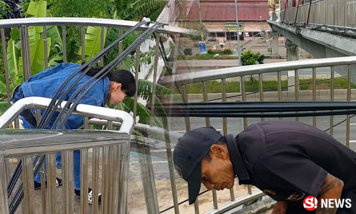 ชาวบ้านโวย! สายไฟผ่ากลางสะพานลอย ใช้เทคนิคขั้นสูงเดินข้าม